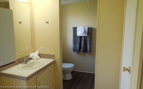 9700 Luther Beck Road Hastings, FL 32145 - Photo 13 of 20 a bathroom with a sink and a mirror