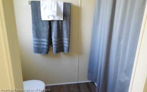 9700 Luther Beck Road Hastings, FL 32145 - Photo 14 of 20 a bathroom with a toilet and a shower curtain