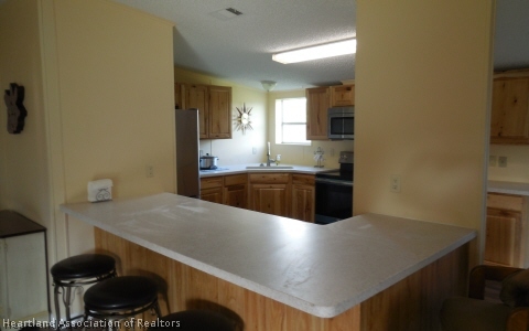 9700 Luther Beck Road Hastings, FL 32145 - Photo 2 of 20 a kitchen with stainless steel appliances a sink stove and refrigerator