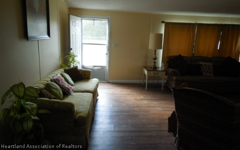 9700 Luther Beck Road Hastings, FL 32145 - Photo 8 of 20 a living room with furniture and a window