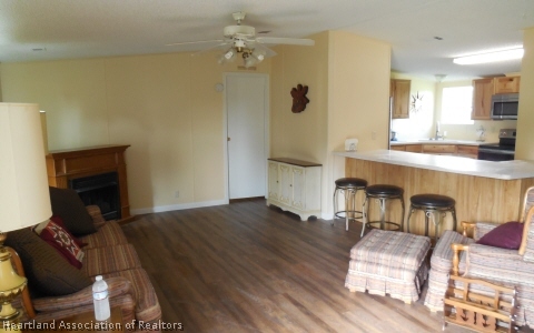 9700 Luther Beck Road Hastings, FL 32145 - Photo 9 of 20 a living room with furniture and a fireplace