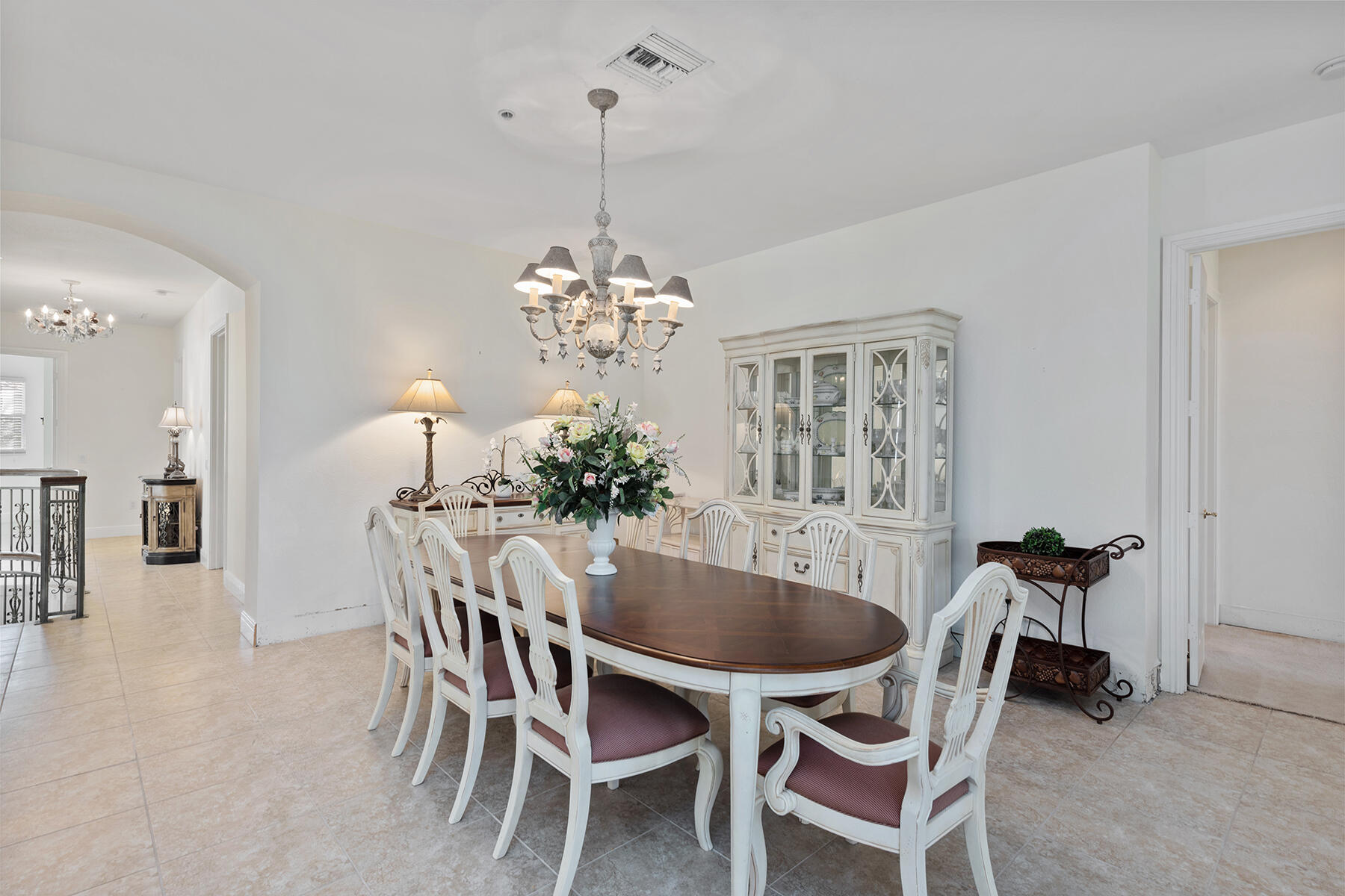 9082 Cascada Way, Unit 202 Naples, FL 34114 - Photo 14 of 37 a dining room with furniture and chandelier