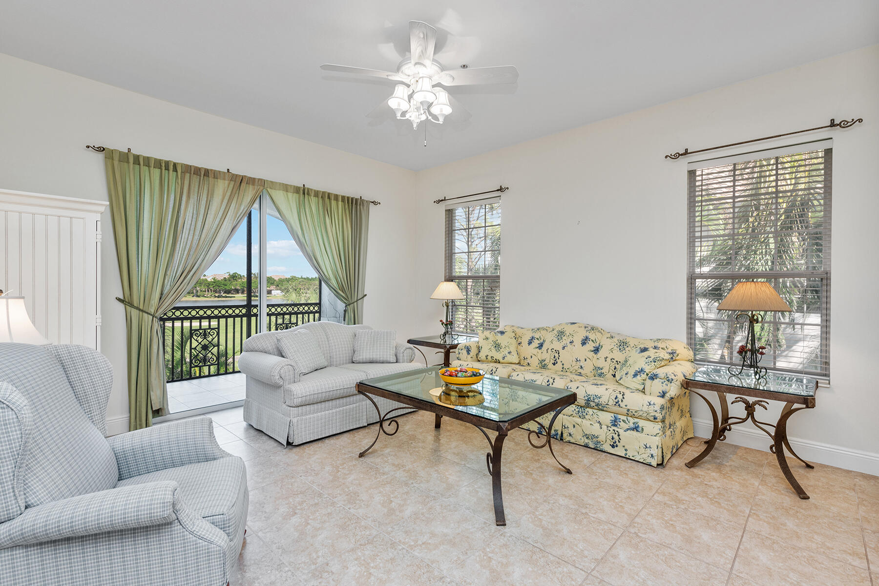 9082 Cascada Way, Unit 202 Naples, FL 34114 - Photo 15 of 37 a living room with furniture and a large window