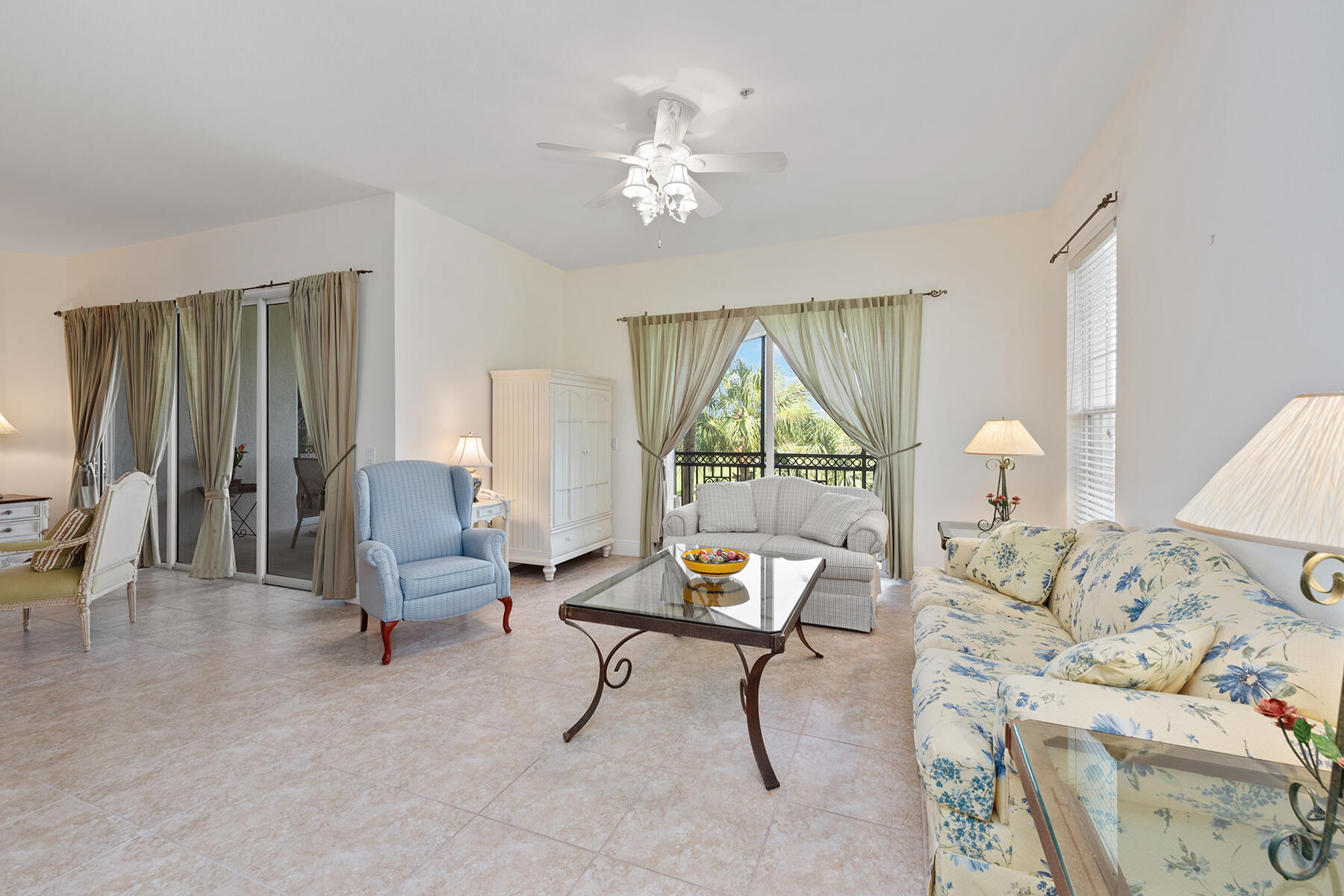 9082 Cascada Way, Unit 202 Naples, FL 34114 - Photo 16 of 37 a living room with furniture and a chandelier