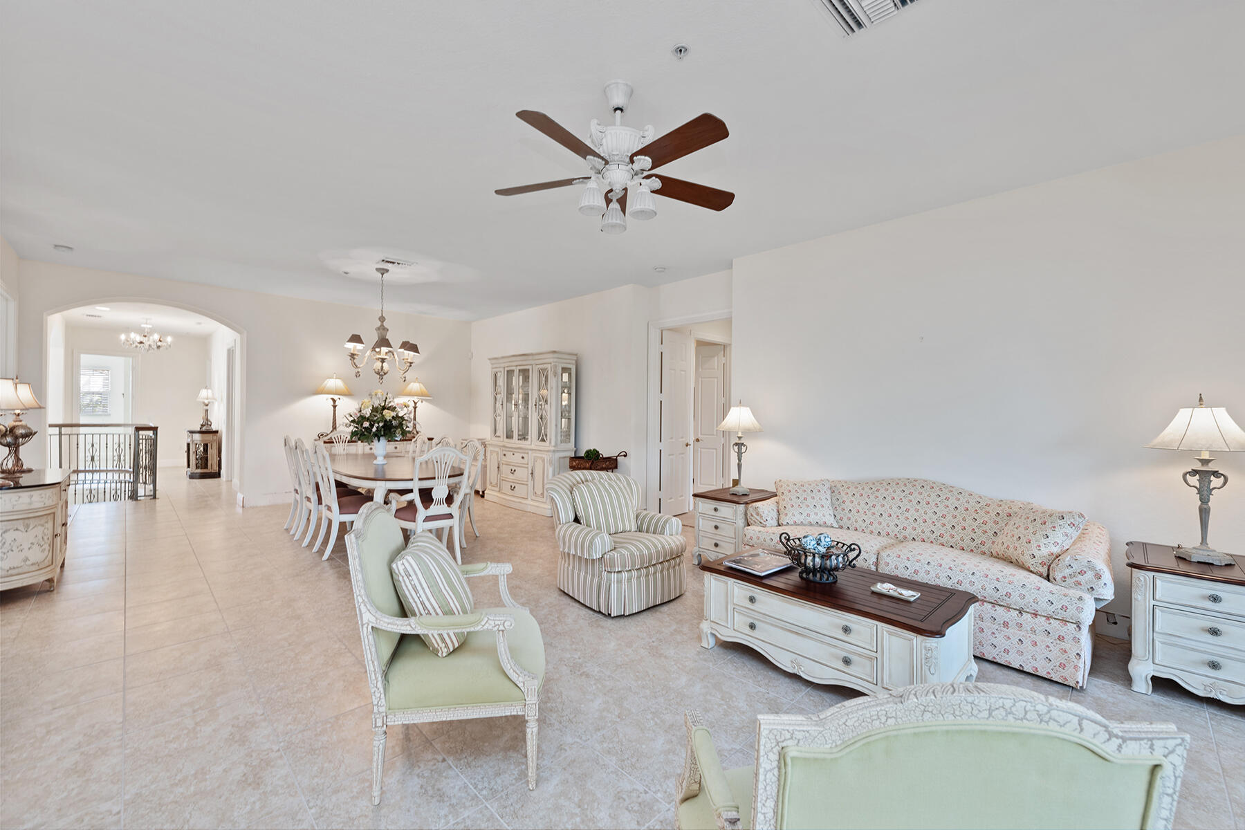 9082 Cascada Way, Unit 202 Naples, FL 34114 - Photo 20 of 37 a living room with furniture and a large window