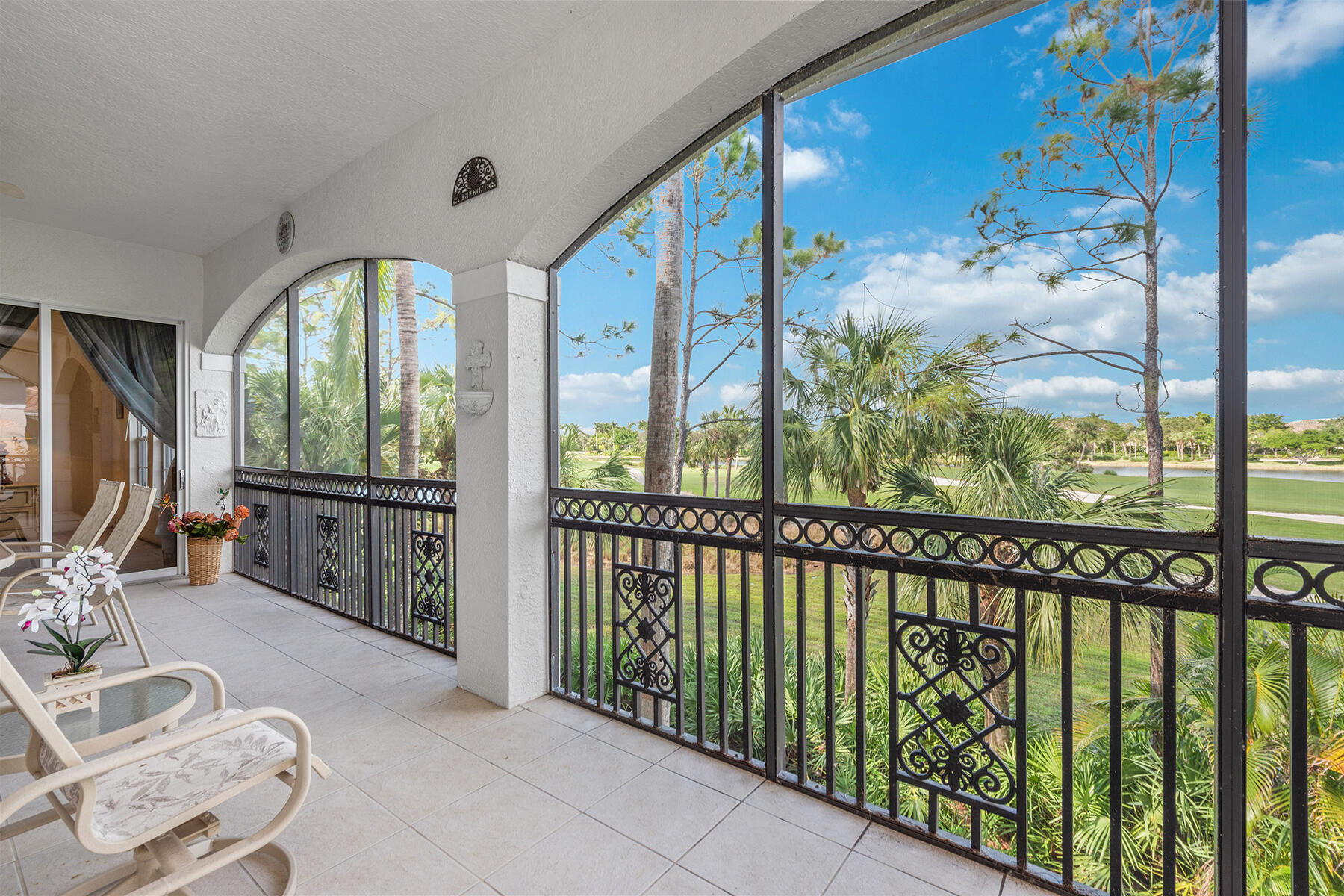 9082 Cascada Way, Unit 202 Naples, FL 34114 - Photo 24 of 37 a view of a porch with furniture