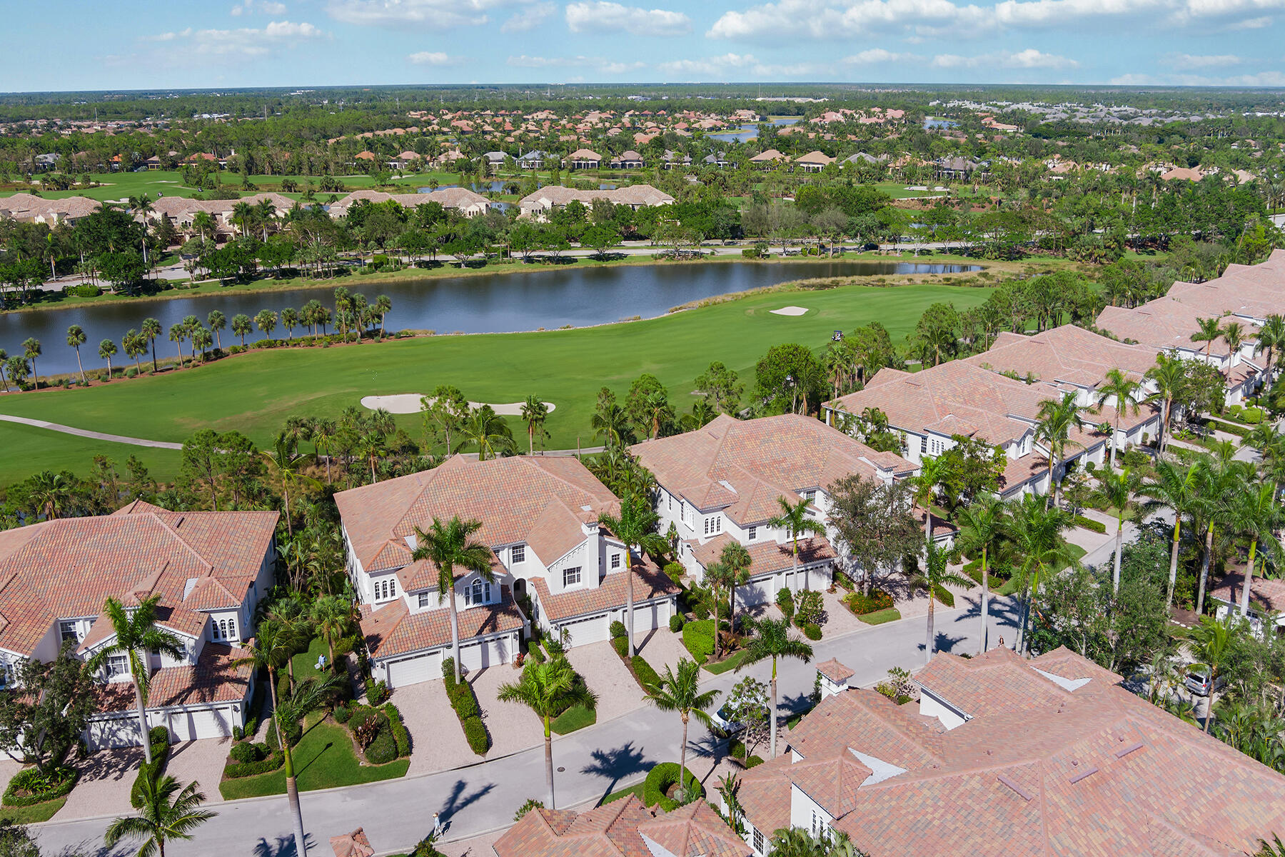 9082 Cascada Way, Unit 202 Naples, FL 34114 - Photo 28 of 37 an aerial view of a city with lake view
