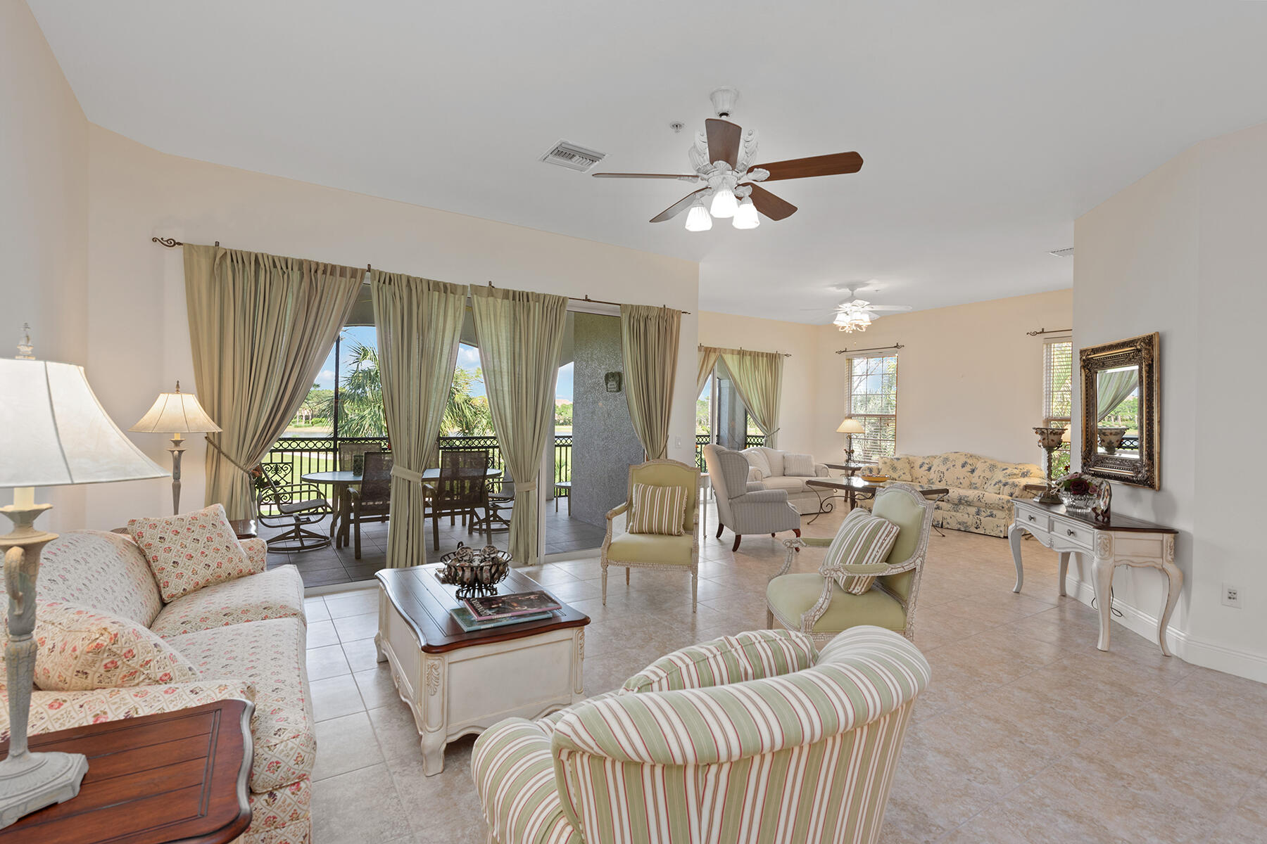 9082 Cascada Way, Unit 202 Naples, FL 34114 - Photo 3 of 37 a living room with furniture and a large window