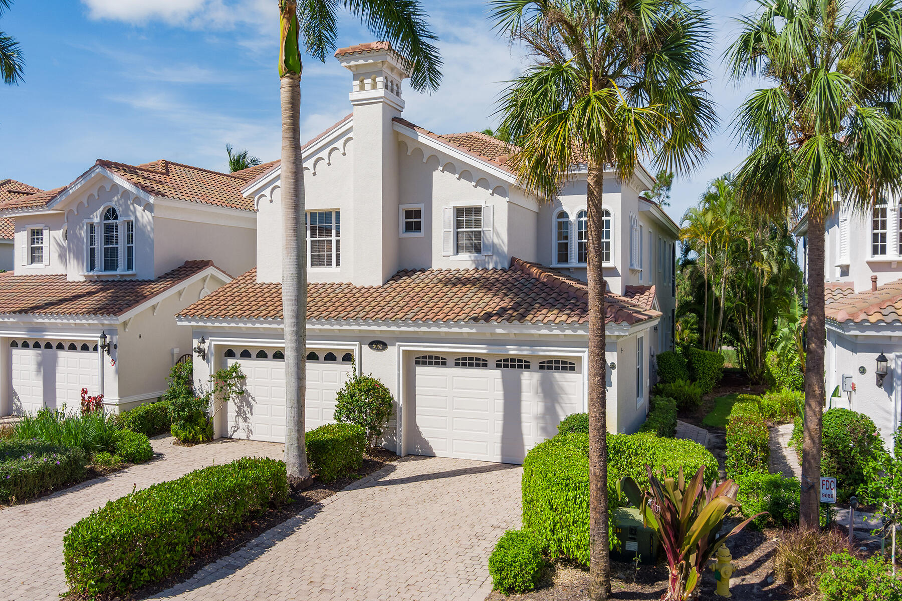 9082 Cascada Way, Unit 202 Naples, FL 34114 - Photo 37 of 37 a front view of a house with a garden