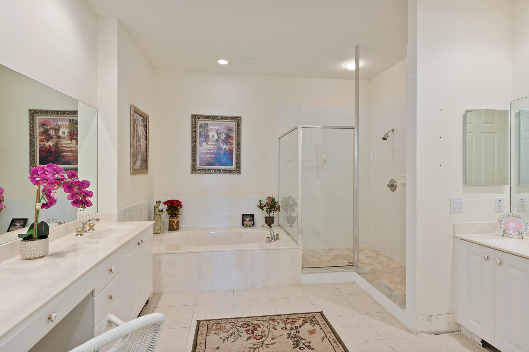 9082 Cascada Way, Unit 202 Naples, FL 34114 - Photo 7 of 37 a bathroom with a tub sink mirror and vanity