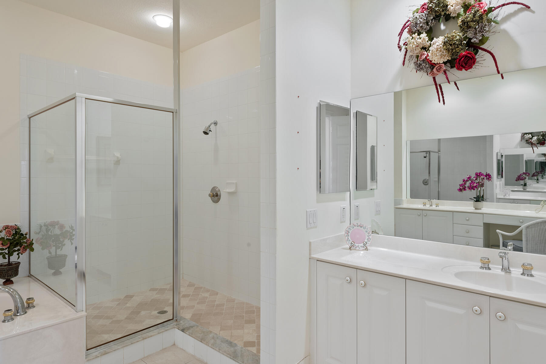 9082 Cascada Way, Unit 202 Naples, FL 34114 - Photo 8 of 37 a bathroom with a double vanity sink and a mirror