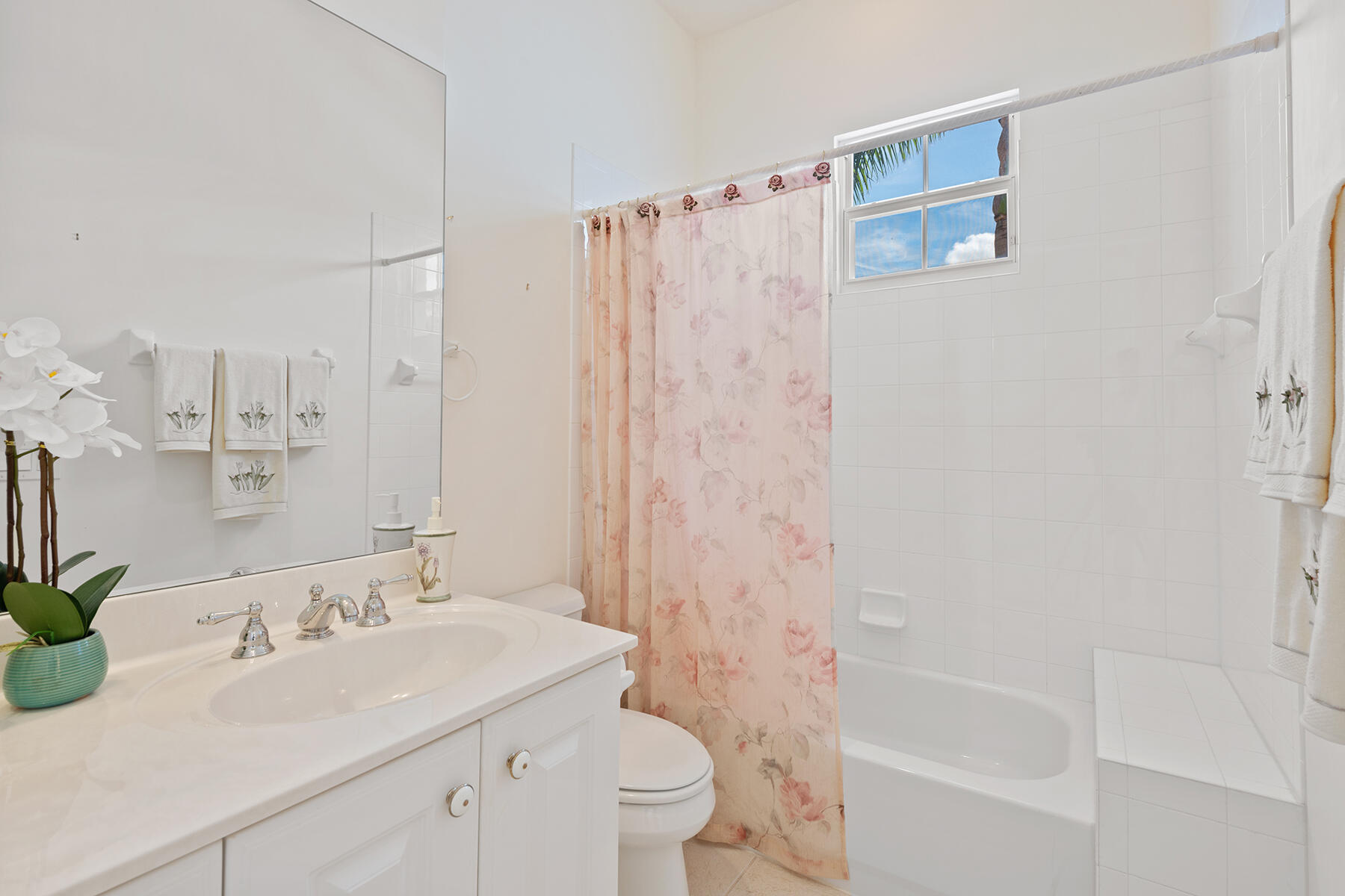 9082 Cascada Way, Unit 202 Naples, FL 34114 - Photo 10 of 37 a bathroom with a sink a toilet and a bathtub