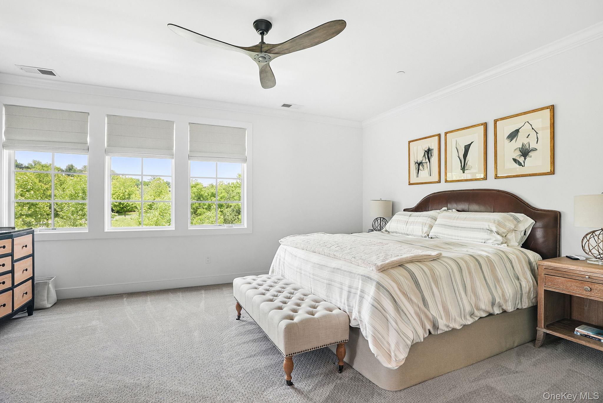 27 Lavender Lane Rye Brook, NY 10573 - Photo 15 of 33 a bedroom with a large bed and a window