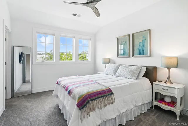 a bedroom with bed and window