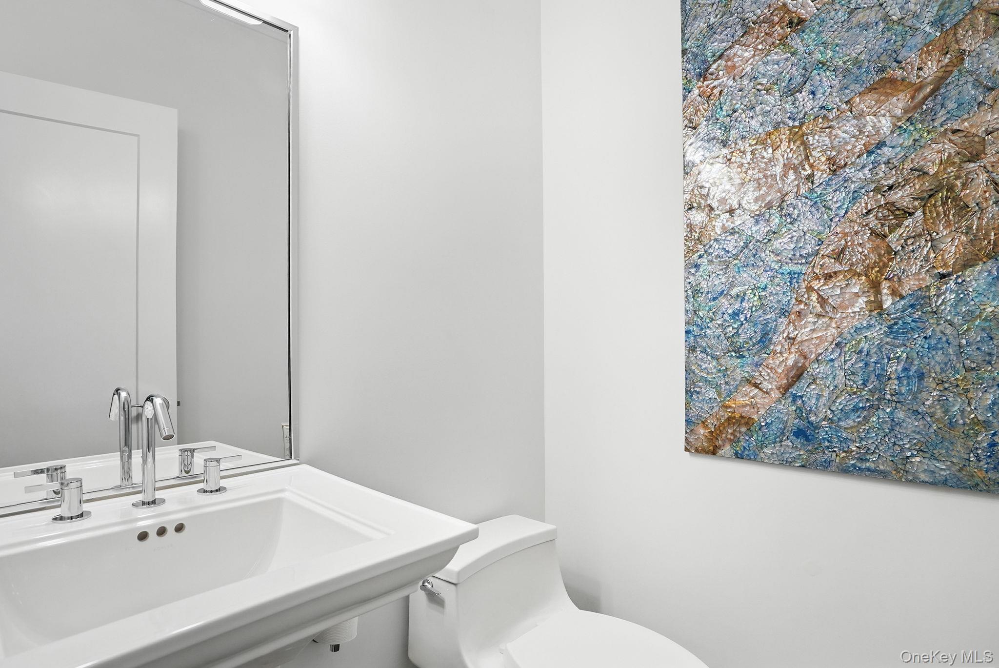 27 Lavender Lane Rye Brook, NY 10573 - Photo 21 of 33 a bathroom with a sink and a toilet