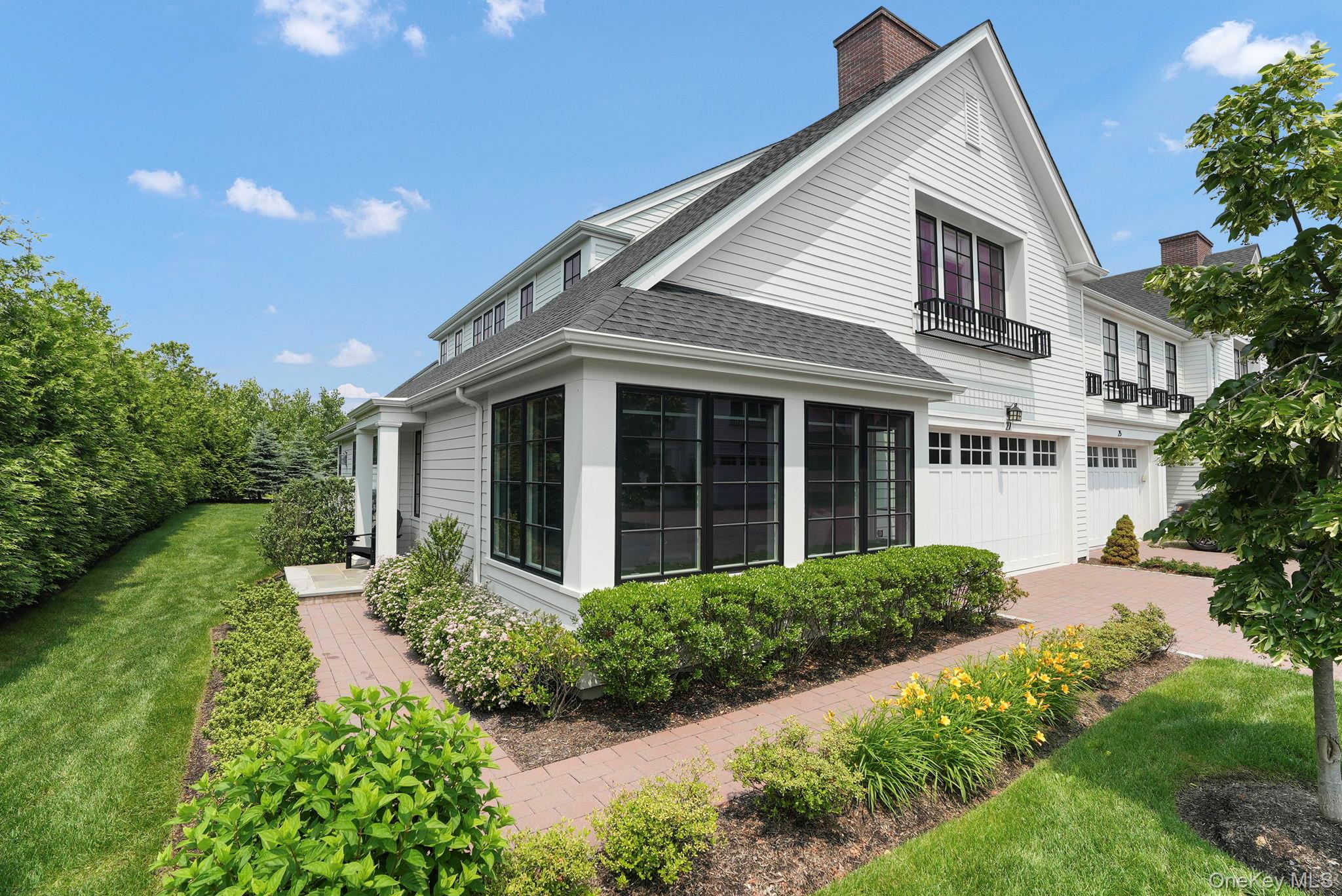 27 Lavender Lane Rye Brook, NY 10573 - Photo 24 of 33 front view of a house with a yard