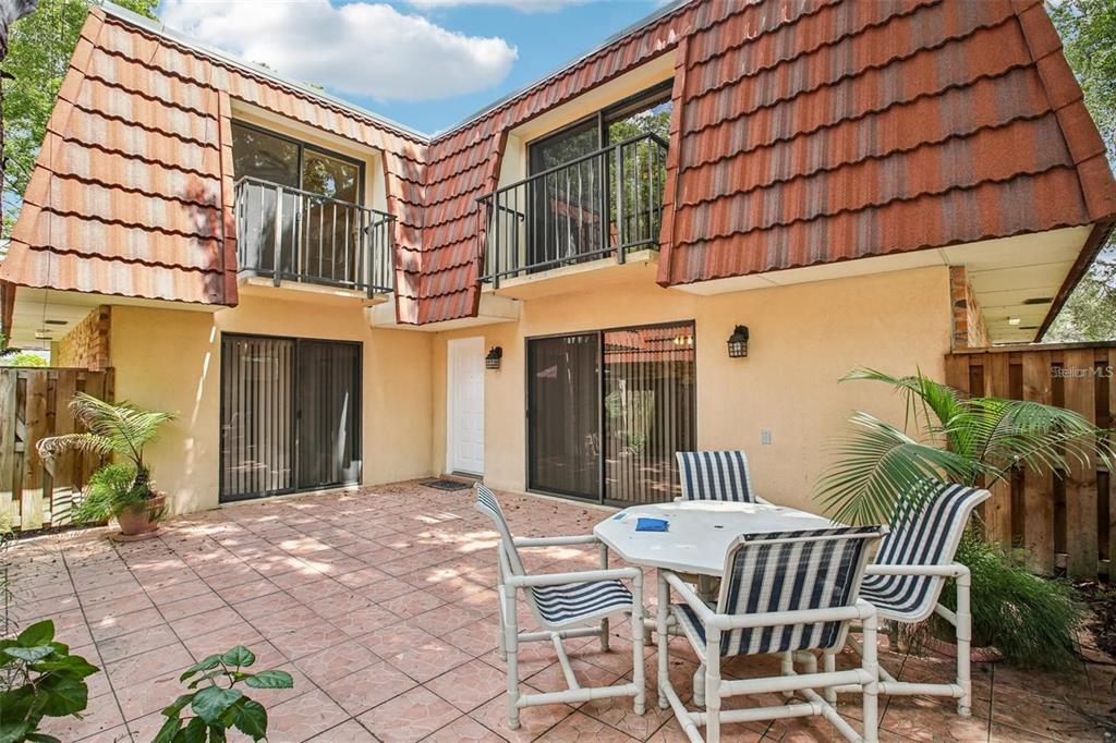 2727 14th Court Palm Harbor, FL 34684 - Photo 1 of 42 a view of patio with a table and chairs