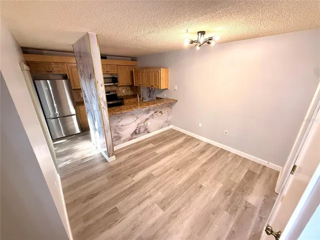 a view of a livingroom with a furniture