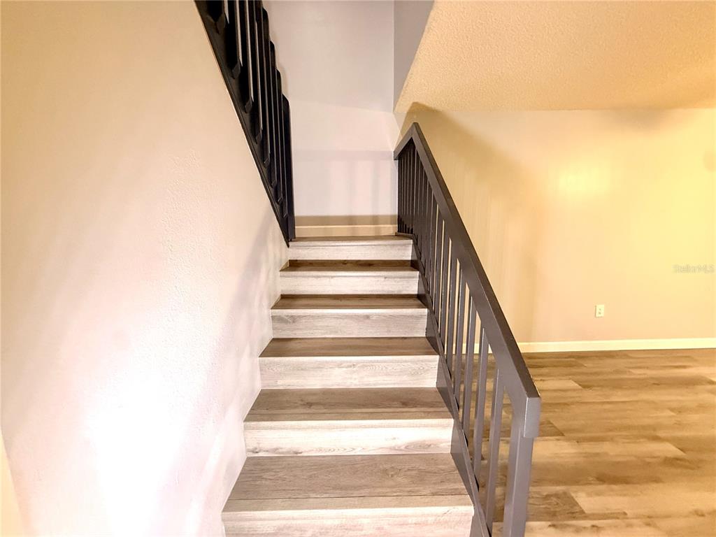 2727 14th Court Palm Harbor, FL 34684 - Photo 18 of 42 a view of staircase with railing and white walls