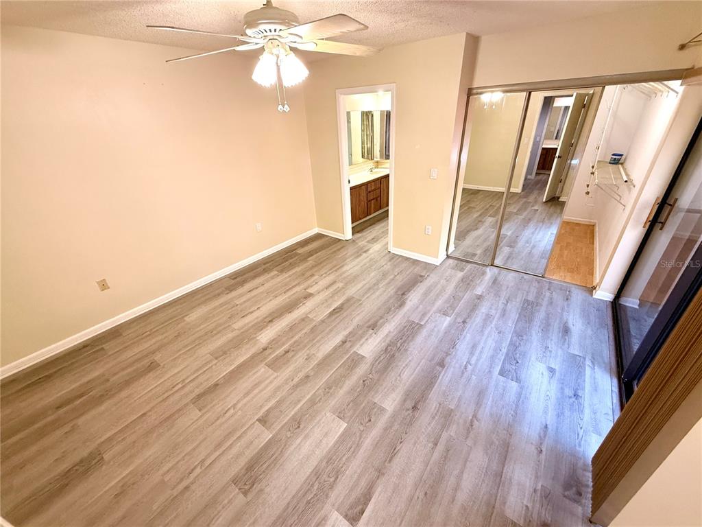 2727 14th Court Palm Harbor, FL 34684 - Photo 24 of 42 a view of a room with wooden floor and staircase