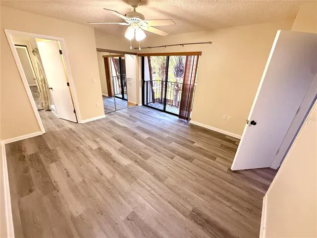 a view of an entryway with wooden floor