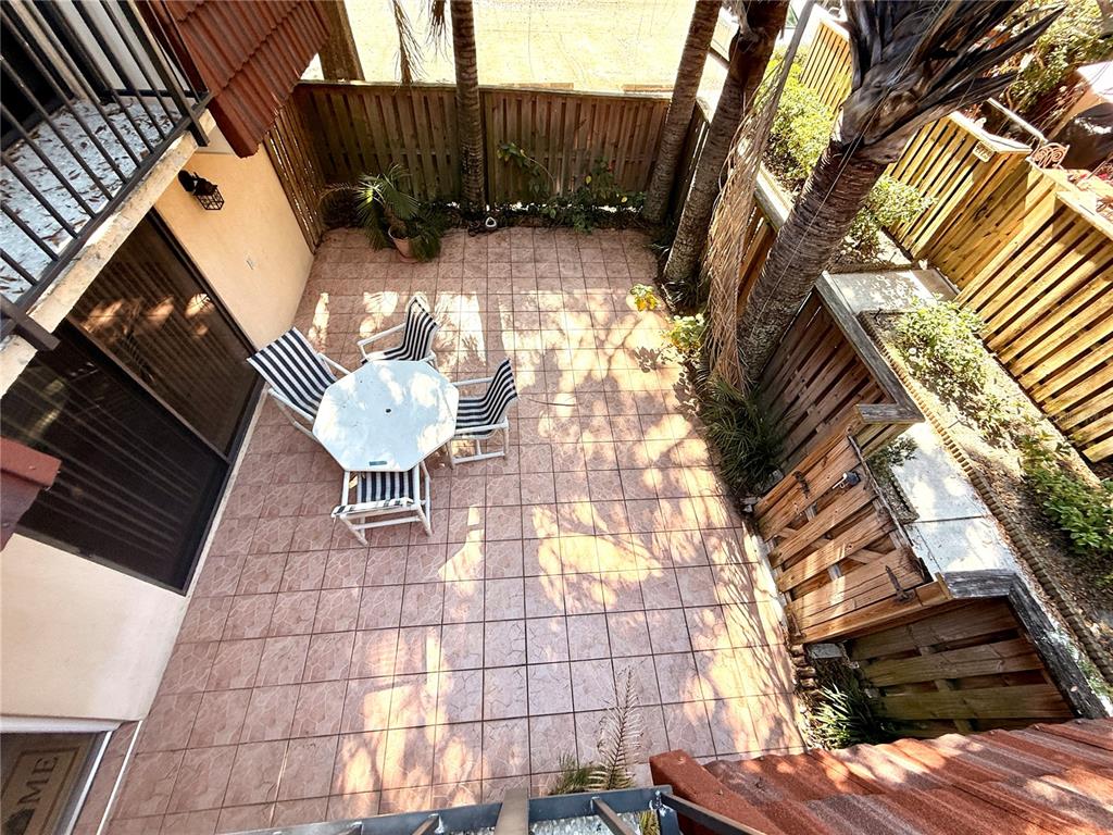 2727 14th Court Palm Harbor, FL 34684 - Photo 39 of 42 a backyard of a house with table and chairs