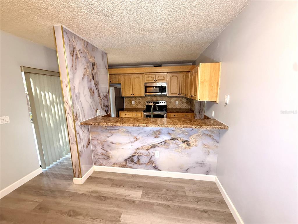 2727 14th Court Palm Harbor, FL 34684 - Photo 5 of 42 a view of living room with furniture and a flat screen tv