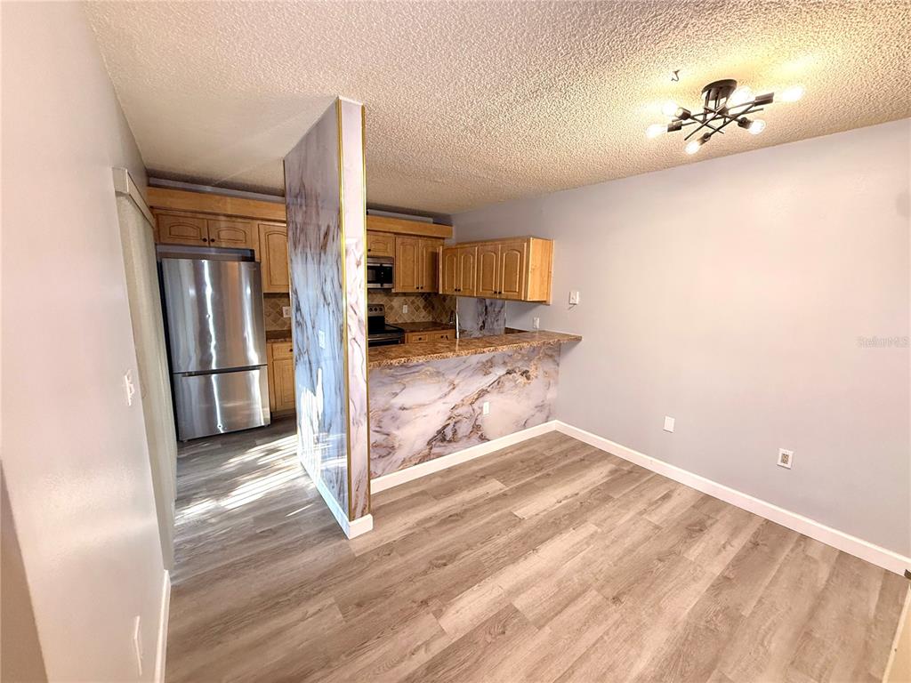 2727 14th Court Palm Harbor, FL 34684 - Photo 6 of 42 a view of a livingroom with wooden floor