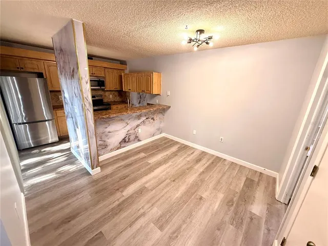 a view of a living room with a sink and a window