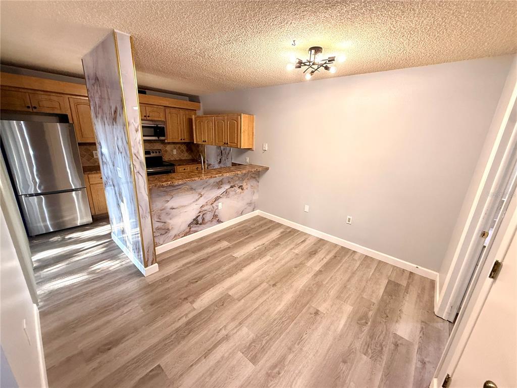2727 14th Court Palm Harbor, FL 34684 - Photo 8 of 42 a view of a living room with a sink and a window