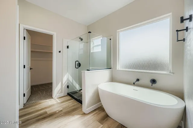 a view of an empty room with a closet