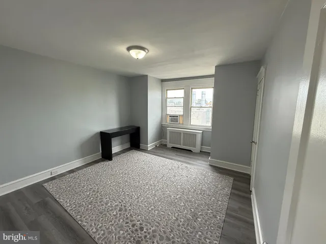 an empty room with a bench