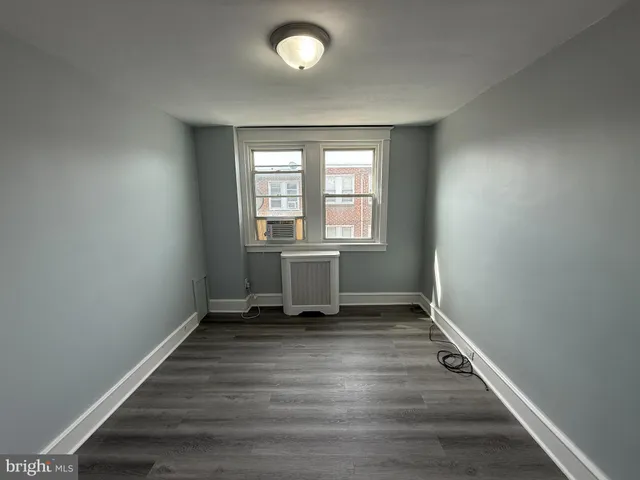 a bathroom with a sink a toilet a mirror and shower