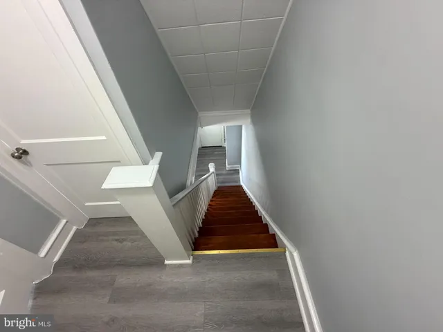 a kitchen with stainless steel appliances a refrigerator sink and stove