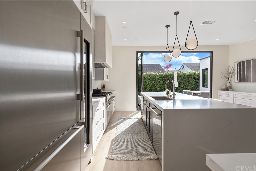 163 Broadway Costa Mesa, CA 92627 - Photo 17 of 56 Stainless steel refrigerator with 58 bottle wine refrigerator.