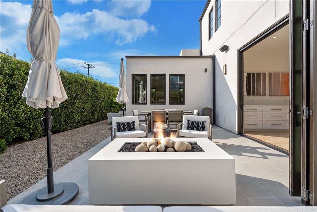 163 Broadway Costa Mesa, CA 92627 - Photo 19 of 56 Relax by the fire feature in the backyard.