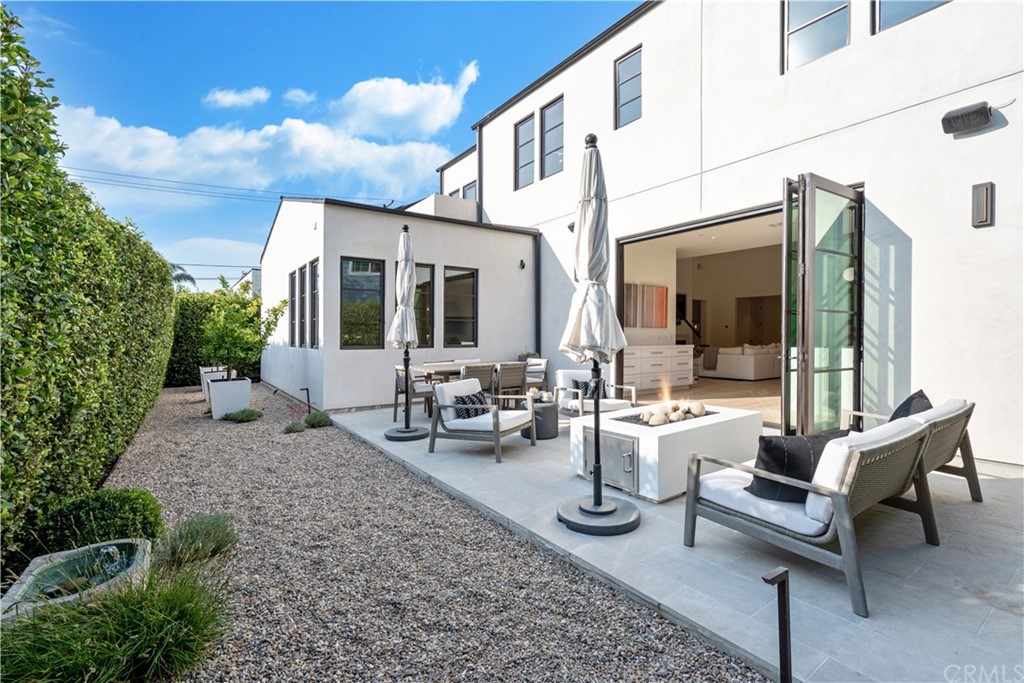 163 Broadway Costa Mesa, CA 92627 - Photo 22 of 56 Serene backyard to enjoy the fire and water features.