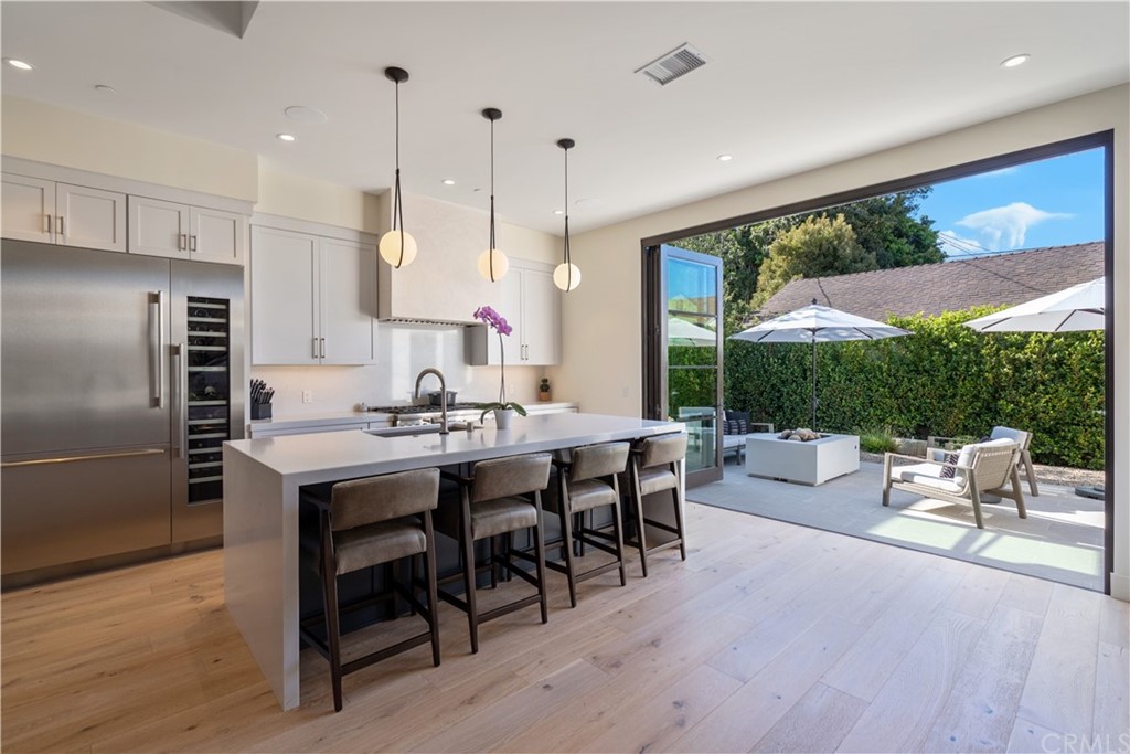 163 Broadway Costa Mesa, CA 92627 - Photo 4 of 56 This stylish kitchen with a large island is a great space to entertain.