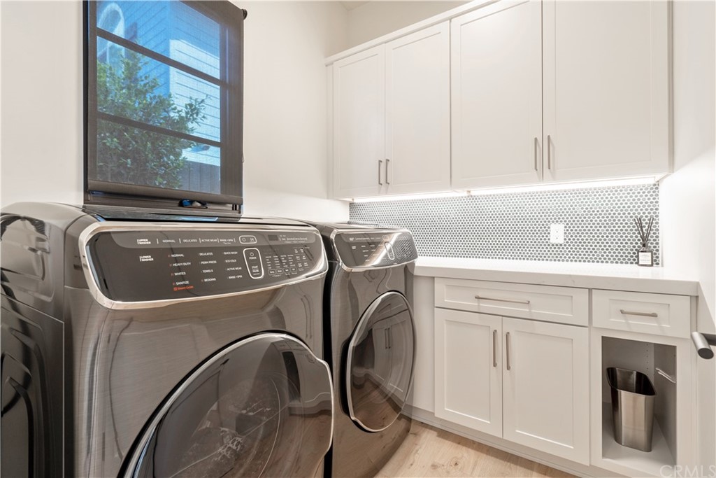 163 Broadway Costa Mesa, CA 92627 - Photo 41 of 56 Large separate laundry room with ample storage.