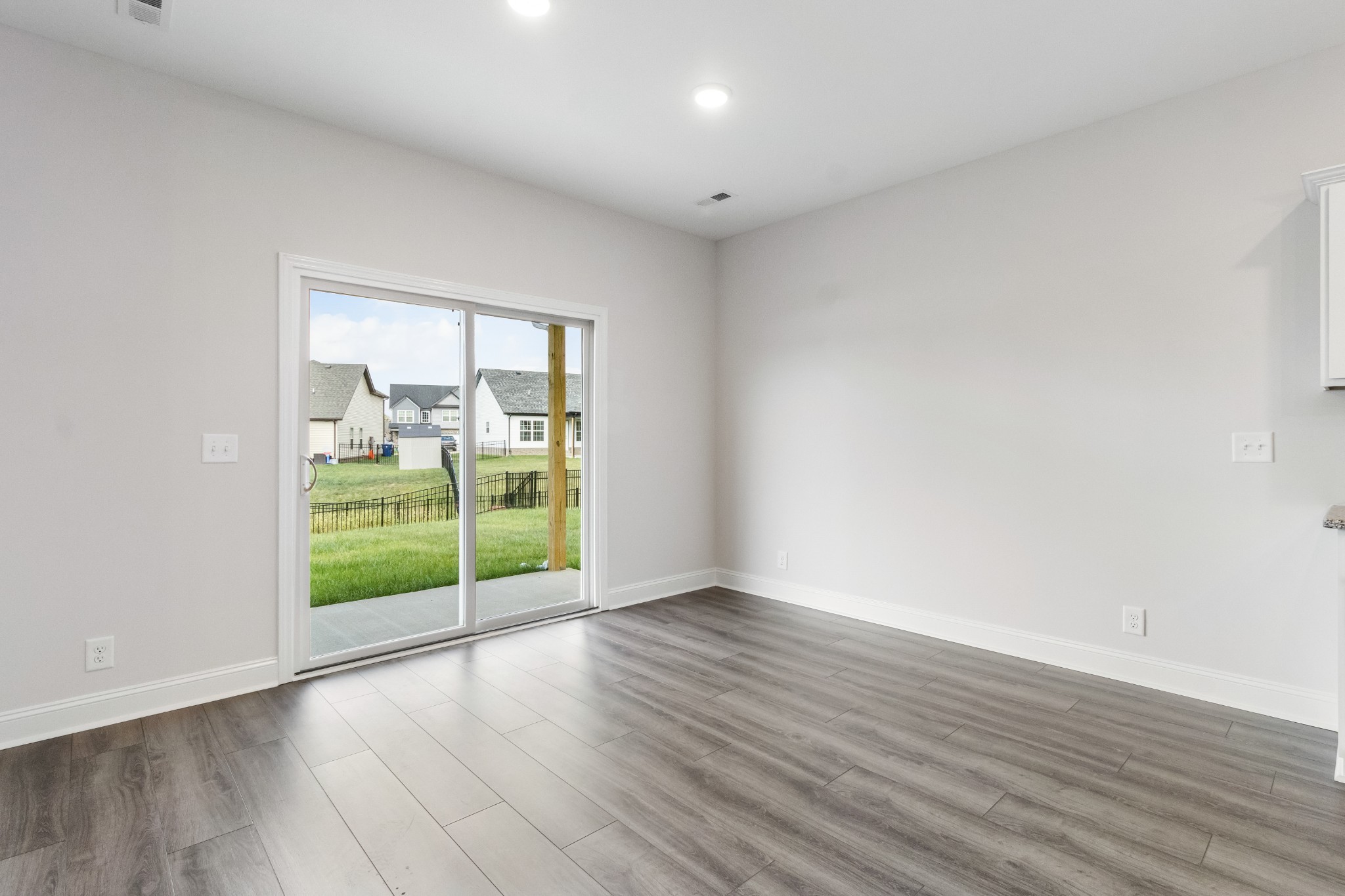 2616 Rafiki Drive Clarksville, TN 37042 - Photo 15 of 36 a view of an empty room with wooden floor and a window