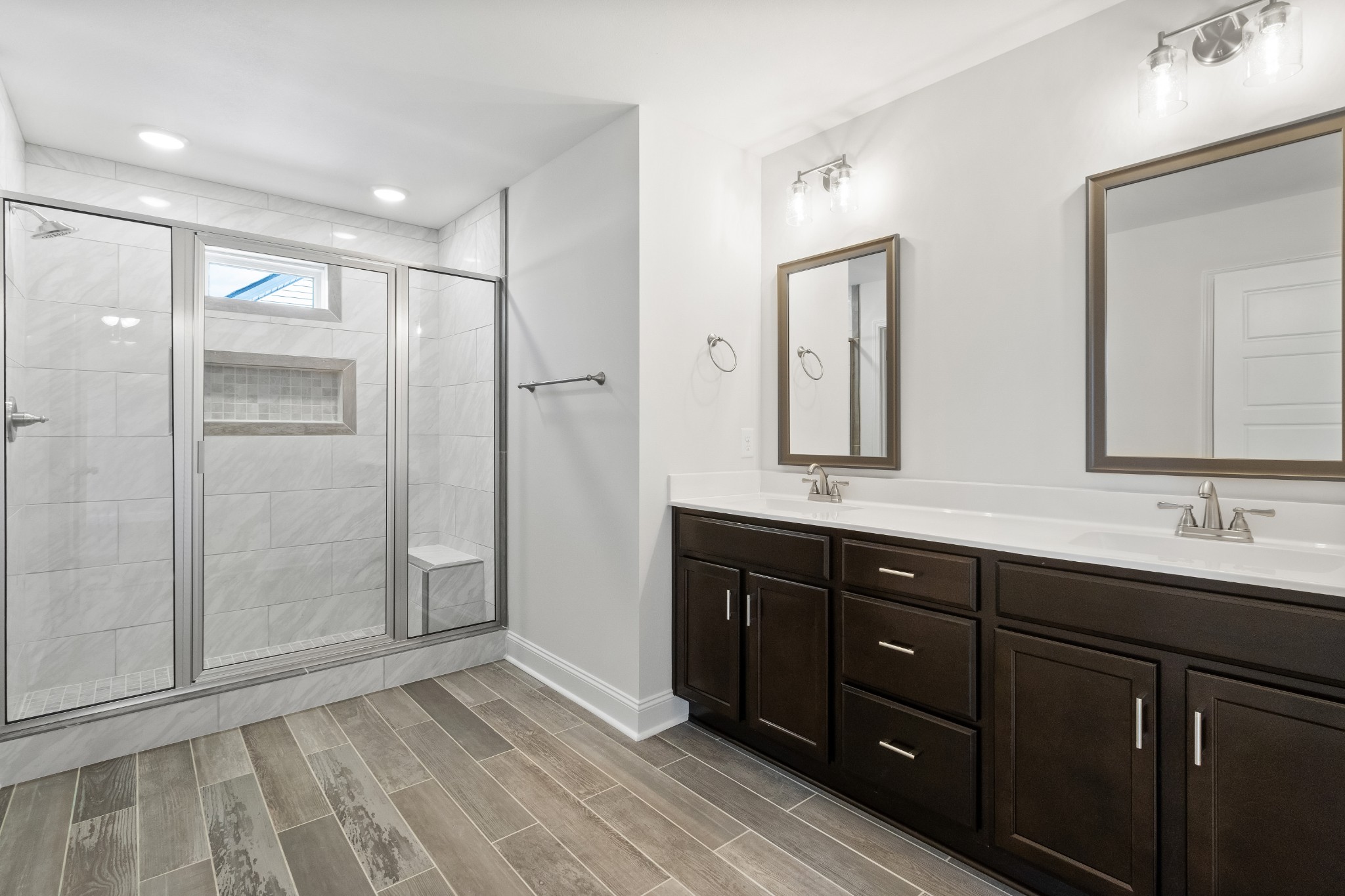 2616 Rafiki Drive Clarksville, TN 37042 - Photo 20 of 36 a bathroom with a double vanity sink mirror and shower