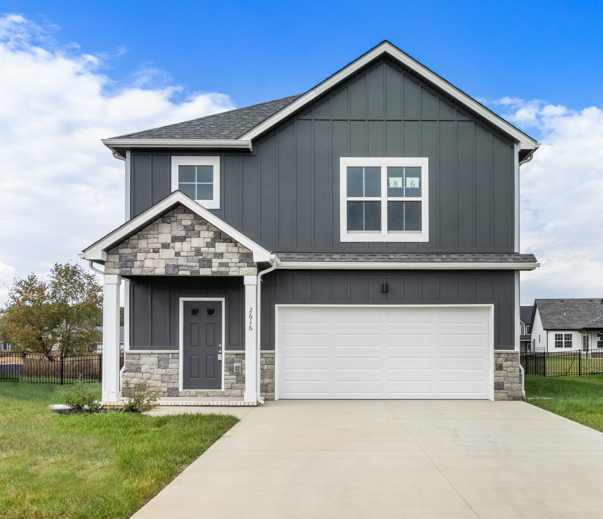 2616 Rafiki Drive Clarksville, TN 37042 - Photo 2 of 36 a front view of a house with a yard and garage
