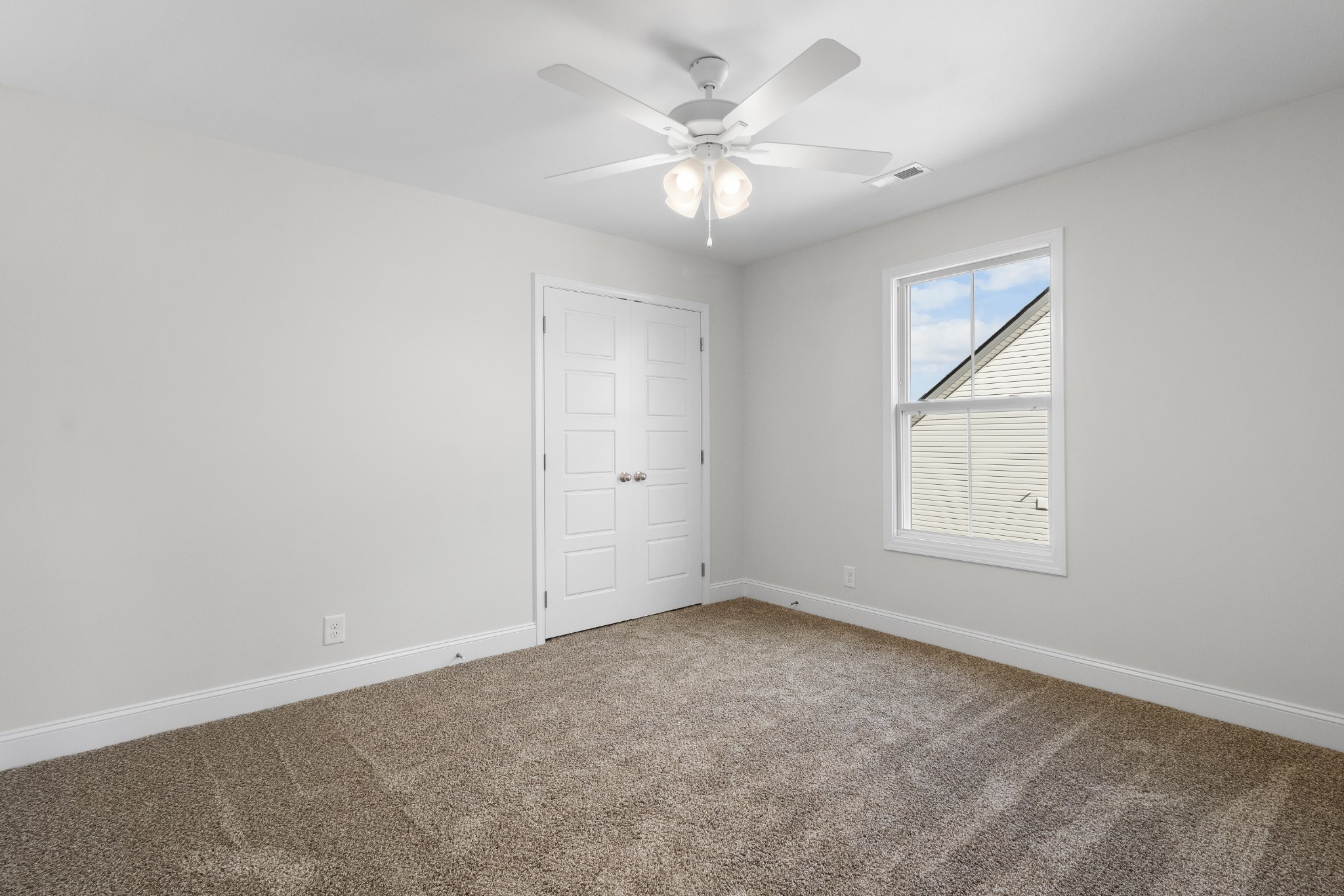 2616 Rafiki Drive Clarksville, TN 37042 - Photo 27 of 36 an empty room with a chandelier fan and windows