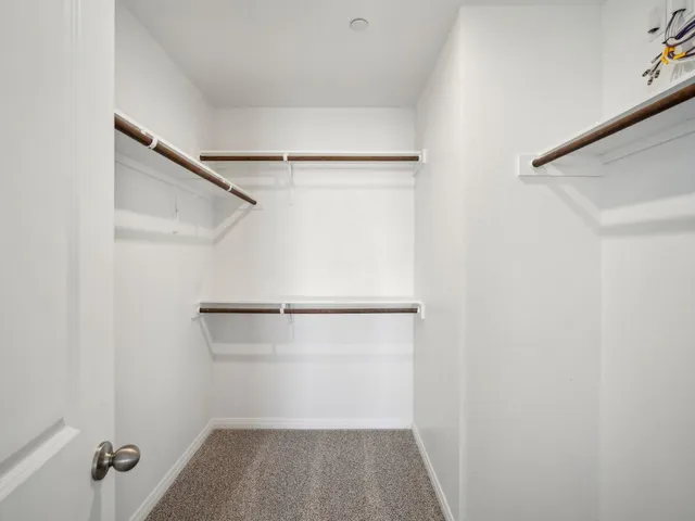 a bathroom with a shower sink and mirror