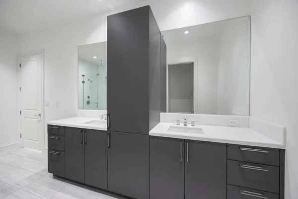 a bathroom with a sink vanity and mirror