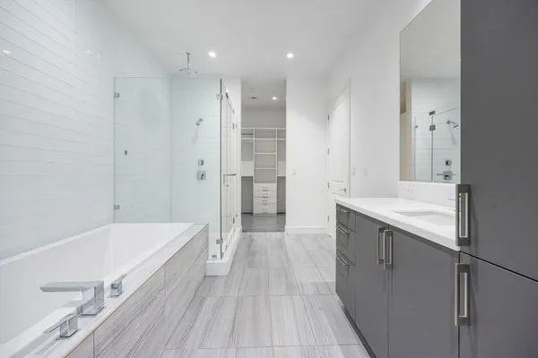 a bathroom with a bathtub and a sink