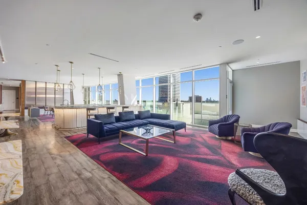 a living room with furniture and a table