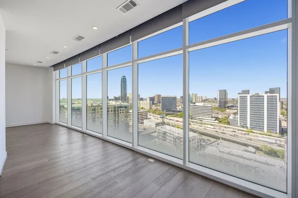 a view of a floor to ceiling window and an empty room
