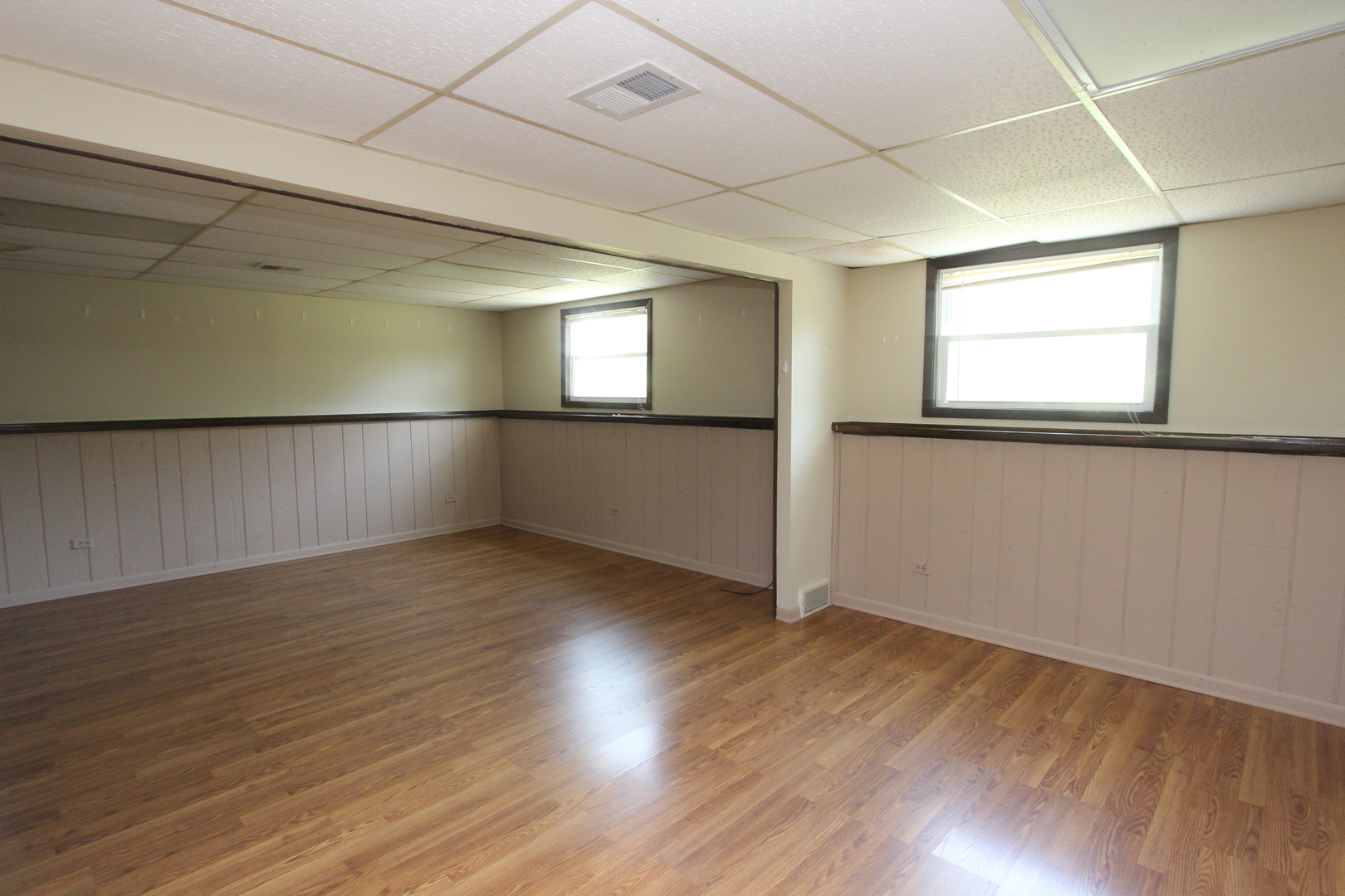 503 Plum Street Lake In The Hills, IL 60156 - Photo 12 of 20 an empty room with wooden floor and windows