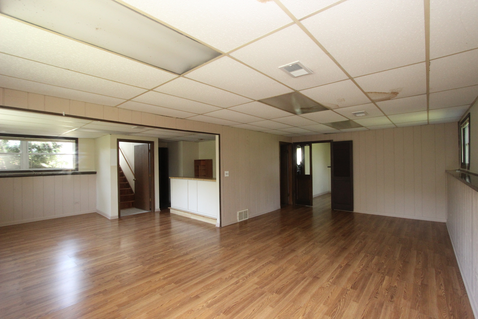 503 Plum Street Lake In The Hills, IL 60156 - Photo 13 of 20 a view of an empty room with window and wooden floor